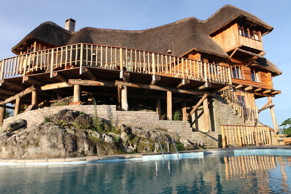 Kyaninga Lodge pool view and main Lodge